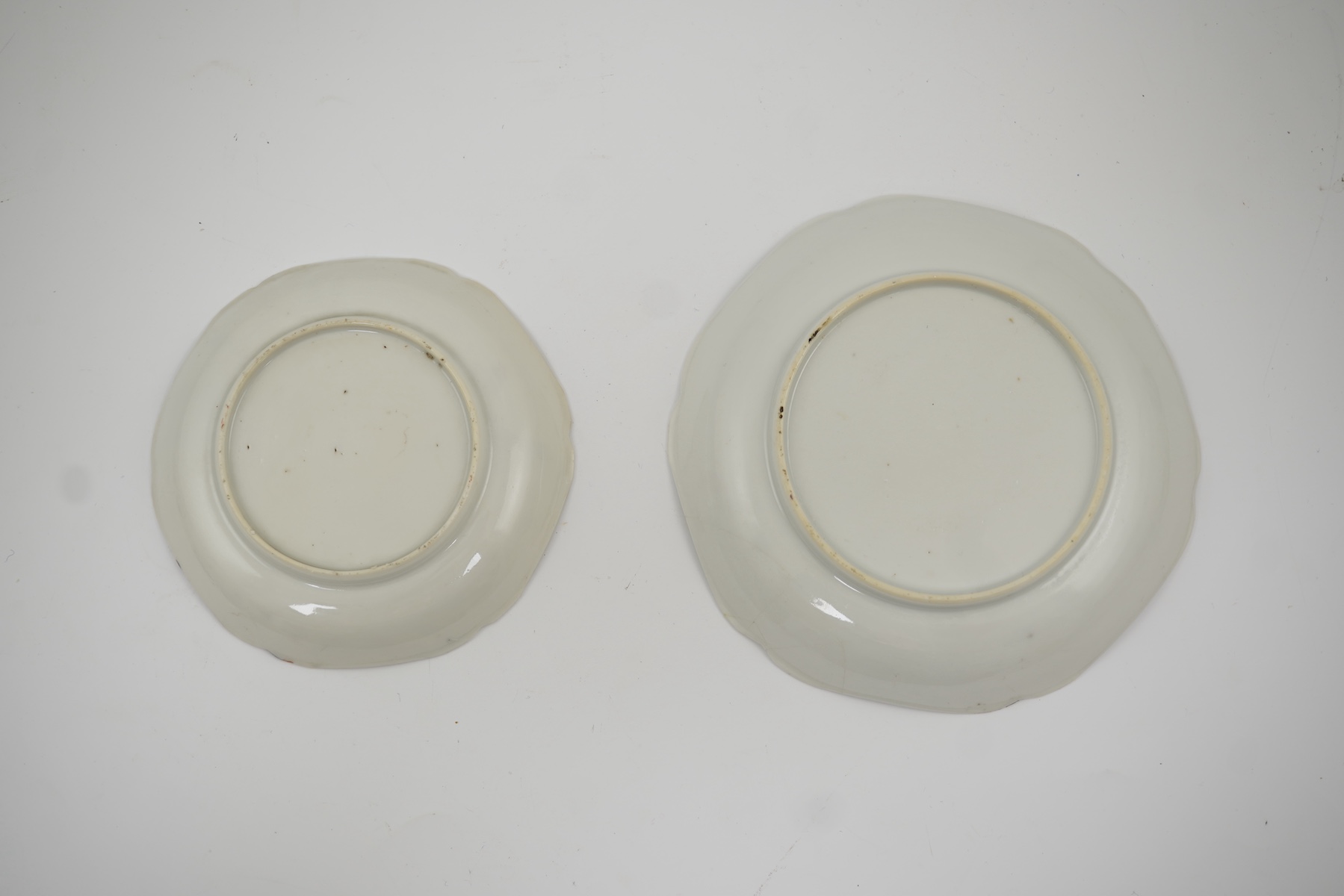 Two Chinese semi-eggshell porcelain hexagonal saucers and a similar cup, Yongzheng/Qianlong period